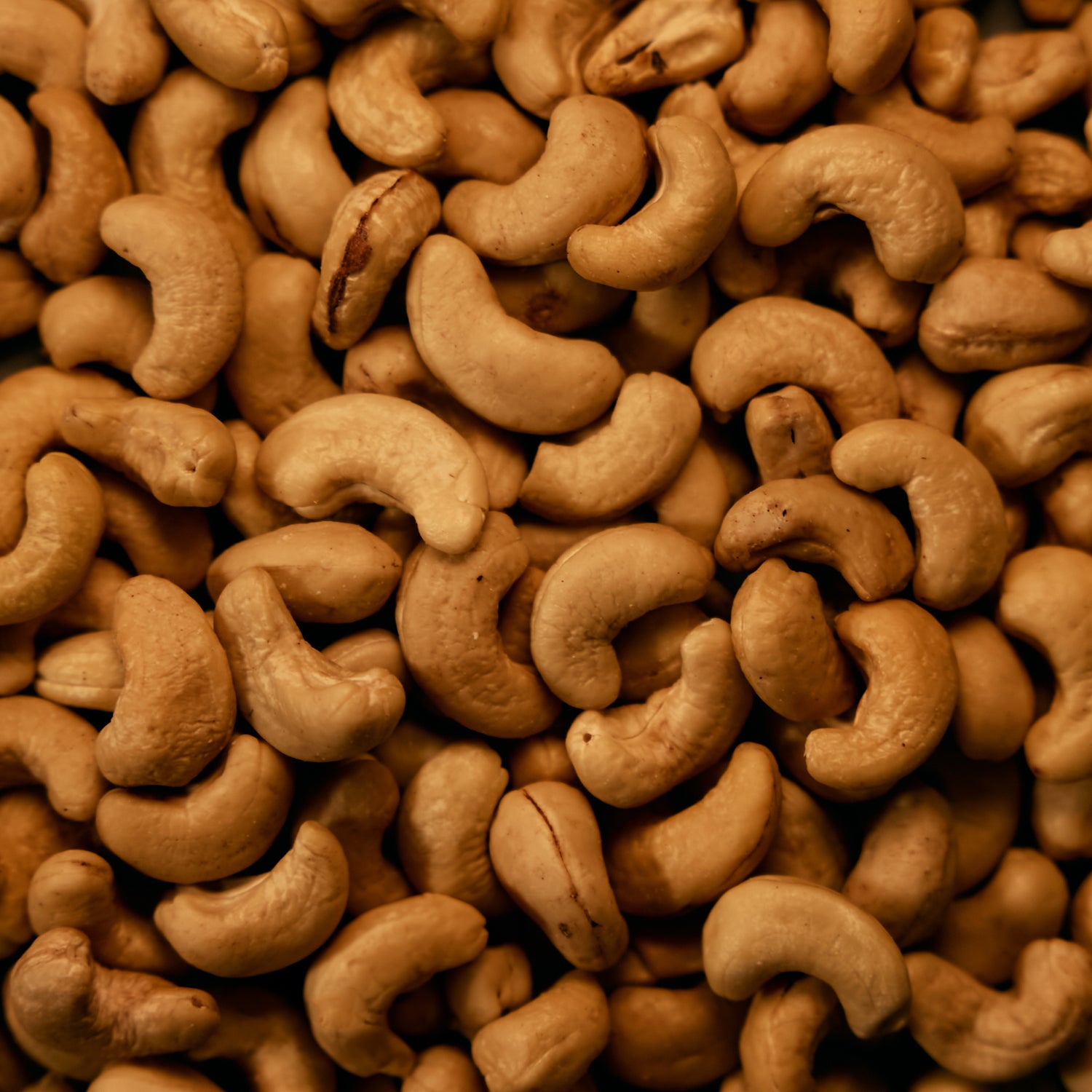 POSSIBLE Close-up of cashews, a key ingredient in POSSIBLE Cashew Date Turmeric Snack Bar, providing healthy fats and plant-based protein.