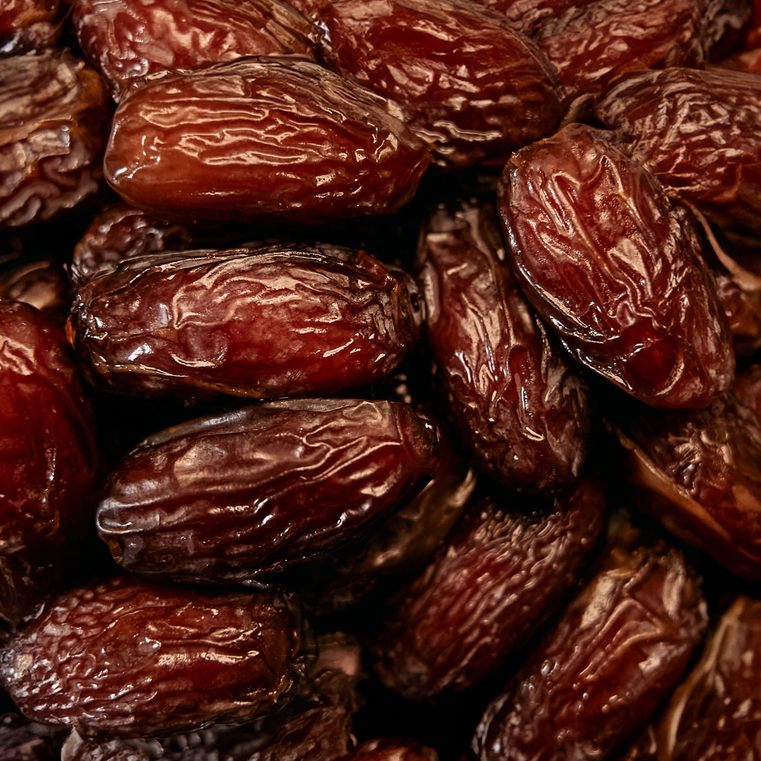 POSSIBLE Close-up of dates, a natural sweetener and energy source in POSSIBLE Cashew Date Turmeric Snack Bar, rich in fiber and essential nutrients.