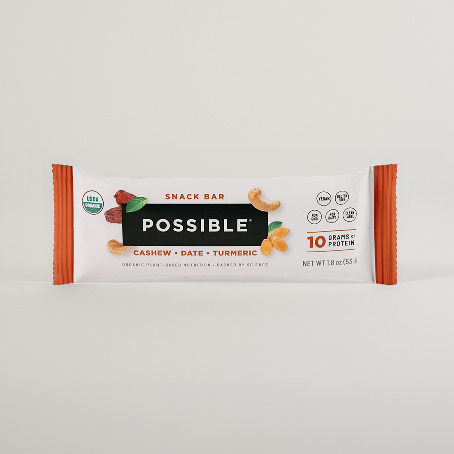 POSSIBLE Cashew Date Turmeric Snack Bar in packaging, emphasizing organic, non-GMO, and 10 grams of plant-based protein benefits.