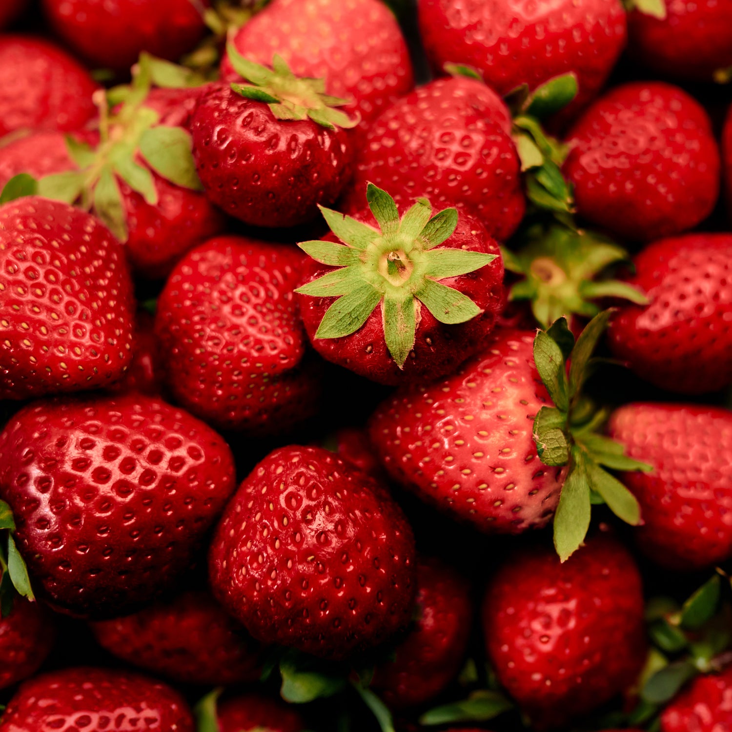 POSSIBLE Close-up of fresh strawberries, a key ingredient in POSSIBLE Strawberry Beet Almond Snack Bar, providing natural sweetness and antioxidants.